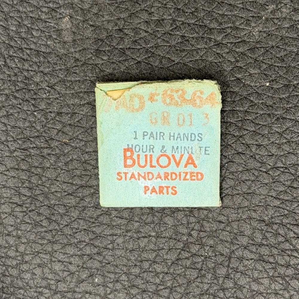 NOS Authentic BULOVA Standard  Watch Part. 7 AD 63-64 GR D13. Hour and min hand.